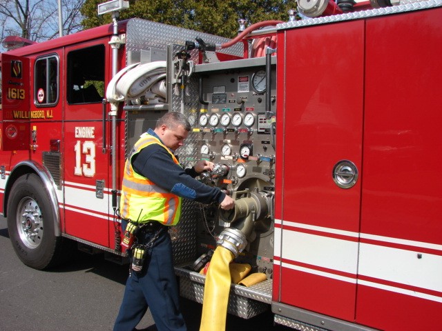 Firefighter Derek O'Donnell securing his supply line at a natural gas leak on Harper Lane